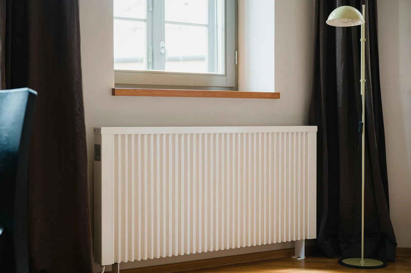 White heating radiator in a bright room