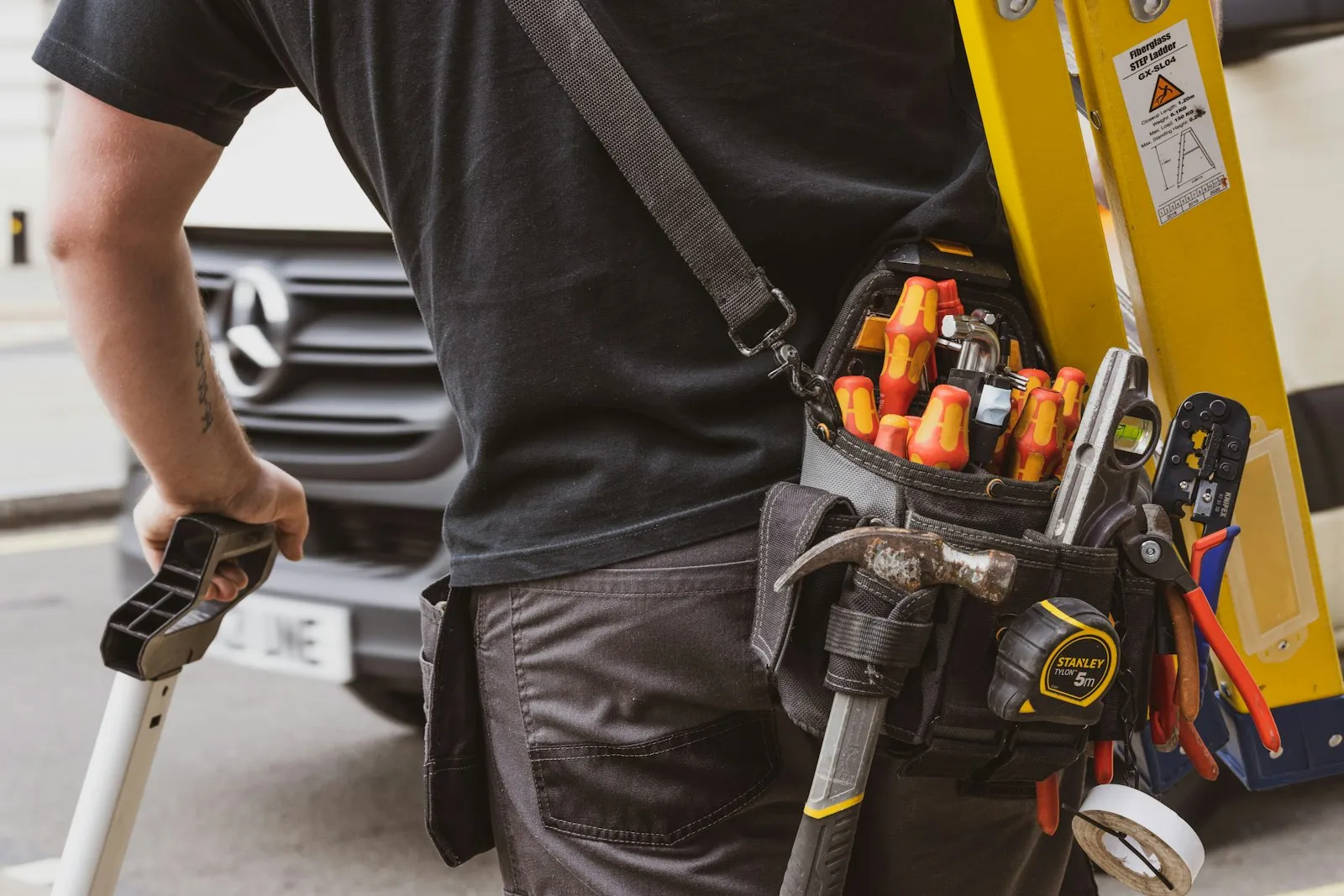 Technician using a power tool during a service call