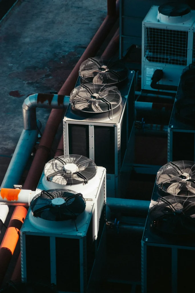 A row of outdoor air conditioning condenser units