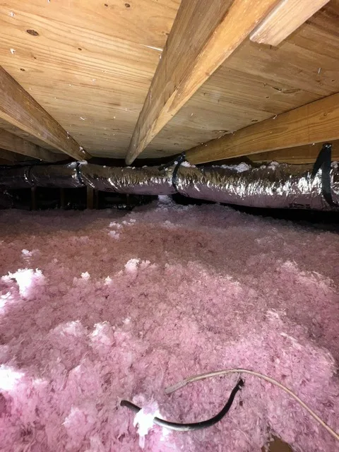 Blown-in attic insulation improving home energy efficiency