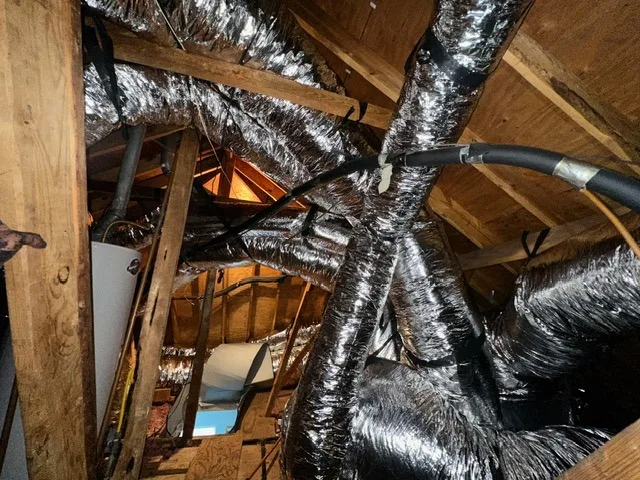 New ductwork being installed in a residential attic