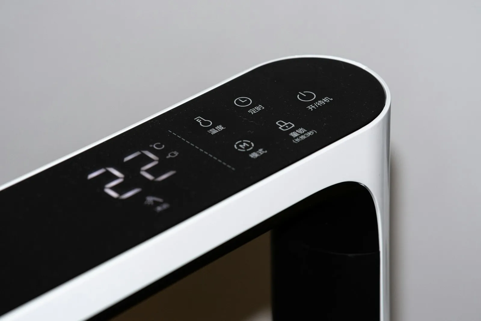Dehumidifier display panel showing 22 percent humidity