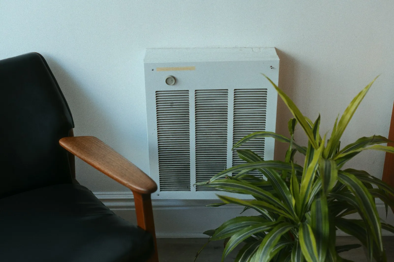 Room heater beside a chair in a home