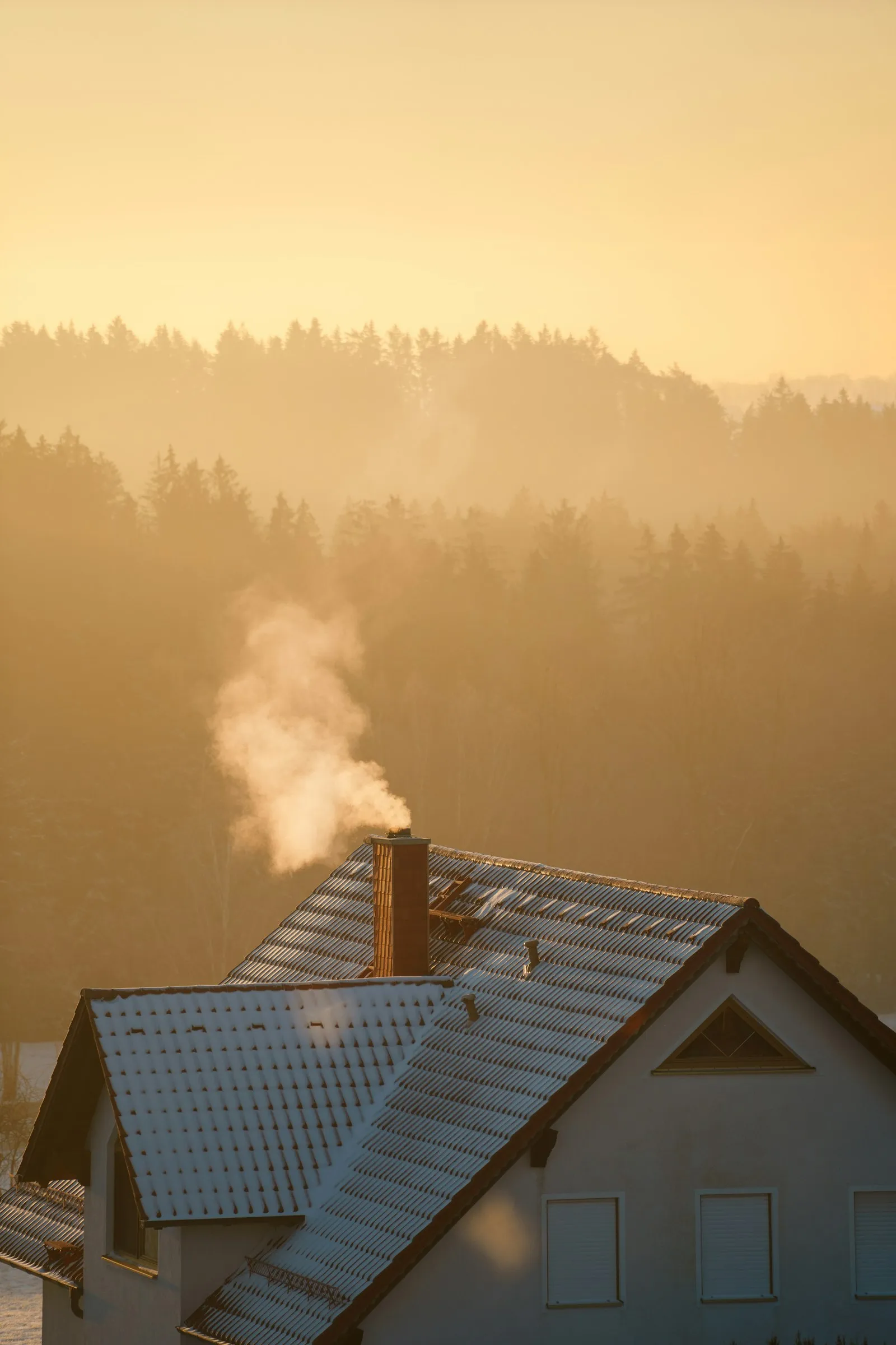 Home chimney venting on a cold day